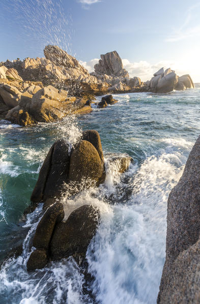 Waves crashing on cliffs at sunset Capo Testa Santa Teresa di Gallura Province of Sassari Sardinia Italy Europe