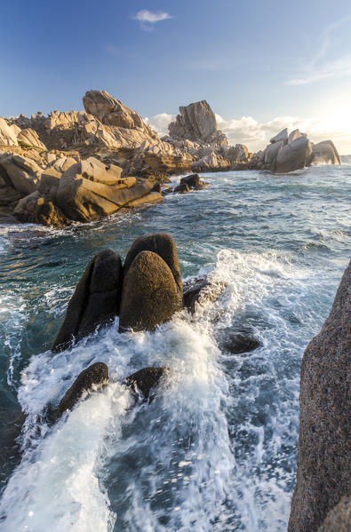 Waves crashing on cliffs at sunset Capo Testa Santa Teresa di Gallura Province of Sassari Sardinia Italy Europe
