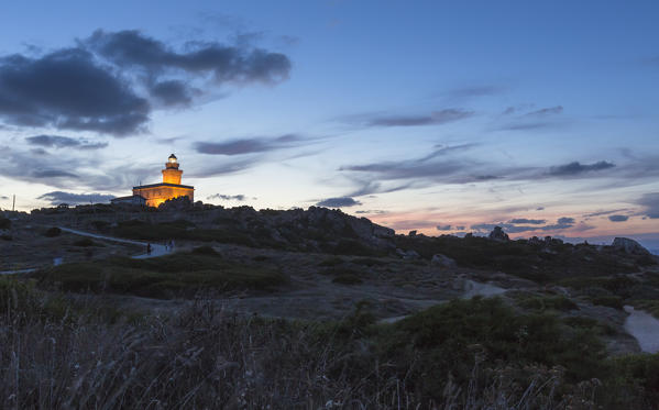 Lights of dusk on the lighthouse surrounded by rock Capo Testa Santa Teresa di Gallura Province of Sassari Sardinia Italy Europe