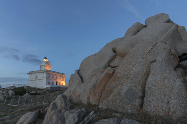 Lights of dusk on the lighthouse surrounded by rock Capo Testa Santa Teresa di Gallura Province of Sassari Sardinia Italy Europe