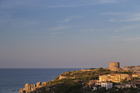 Sunset lights on Longosardo Tower and village of Santa Teresa di Gallura Province of Sassari Sardinia Italy Europe