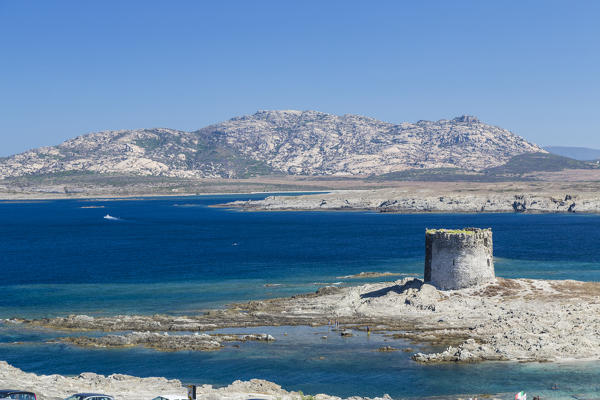 Blue sea and medieval tower surround La Pelosa Beach Stintino Asinara National Park Province of Sassari Sardinia Italy Europe