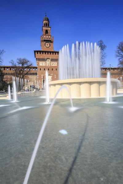 The fountain frames the ancient Sforza Castle Milan Lombardy Italy Europe