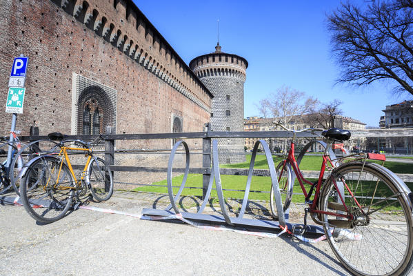 Bicycles parked at the entrance of the ancient Sforza Castle Milan Lombardy Italy Europe