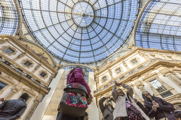 View of the glass dome and artistic decorations of the historical Galleria Vittorio Emanuele II Lombardy Italy Europe