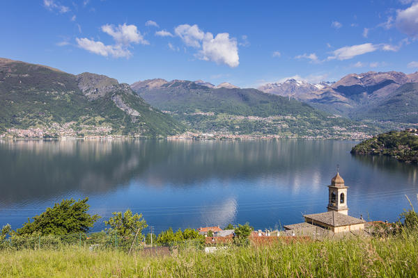 View of the bell tower and village of Dorio surrounded by Lake Como Province of Lecco Lombardy Italy Europe