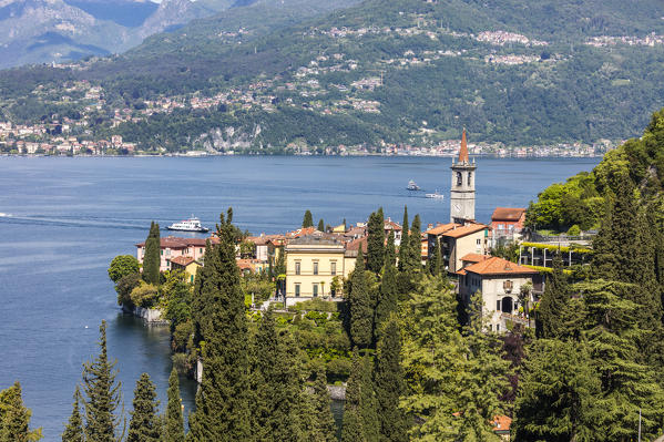 The typical village of Varenna surrounded by the blue water of Lake Como and gardens Province of Lecco Lombardy Italy Europe
