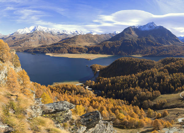 Panoramic of the colorful woods around Lake Sils in autumn Plaun da Lej Upper Engadine Canton of Graubunden Switzerland Europe