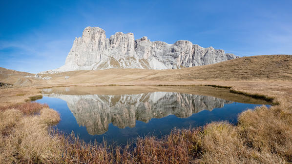 Lastoni di Formin reflected in Lake Baste, Mondeval, Selva di Cadore, province of Belluno, Veneto, Italy