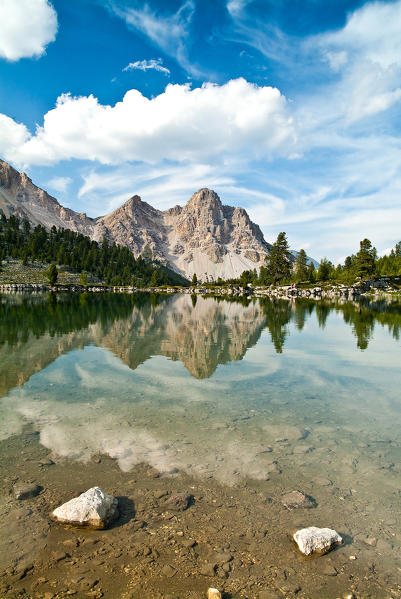 The Furcia dai Fers reflecting in the Lake Verde at the Malga di Fanes Piccola in the Fanes-Sennes-Braies Natural Park Dolomites Trentino Alto Adige Italy Europe