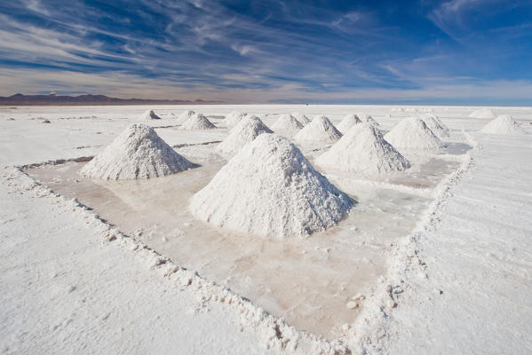 Pyramids of salt drying by Uyuni, a small village giving its name to the whole salt flat Bolivia South America