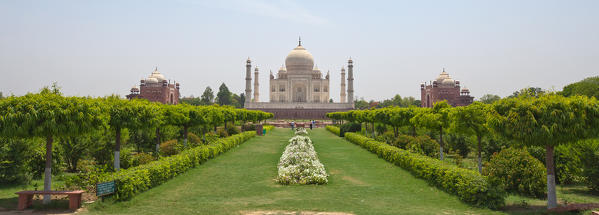 The Taj Mahal is located on the right bank of the Yamuna River in a vast Mughal garden that encompasses nearly 17 hectares, in the Agra District in Uttar Pradesh. It was built by Mughal Emperor Shah Jahan in memory of his wife Mumtaz Mahal Agra, India