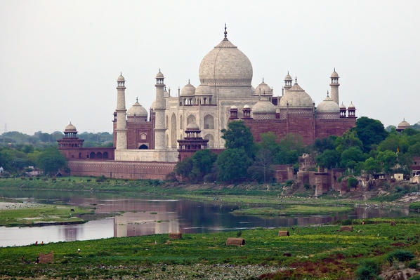 The Taj Mahal, a jewel of Muslim art in India and one of the universally admired masterpieces of the world's heritage, and the River Yamuna Agra, India