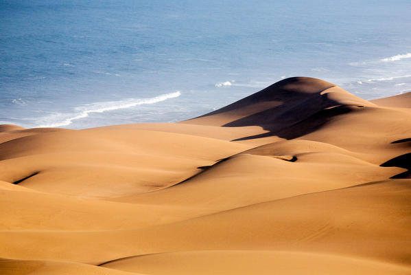 The Southern Namib desert is home to some of the tallest and most spectacular dunes of the world, ranging in color from pink to vivid orange. We flew across the desert to the star-shaped dunes at Sossusvlei, or the 