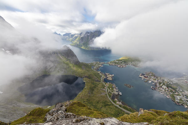 Top view of lakes and sea under the cloudy sky at summer Reinebringen Moskenes Lofoten Islands Norway Europe