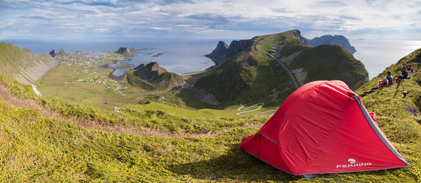 Panorama of tent on mountain ridge overlooking the sea Sorland Vaeroy Island Nordland county Lofoten archipelago Norway Europe