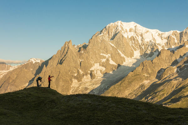Photographers admire the Mont Blanc massif at dawn Graian Alps Courmayeur Aosta Valley Italy Europe