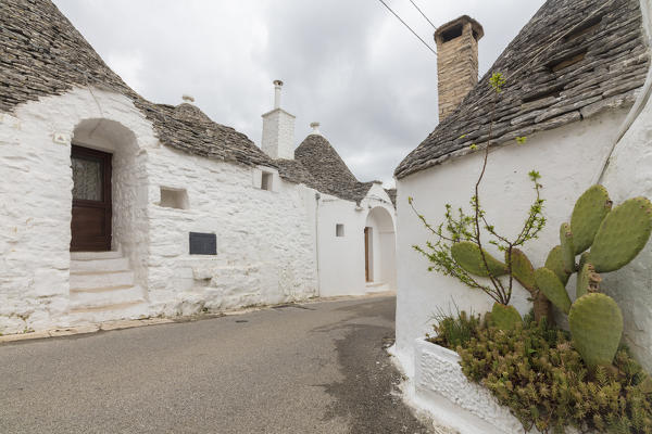 The typical huts called Trulli built with dry stone with a conical roof Alberobello province of Bari Apulia Italy Europe