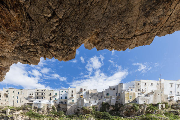 View of typical white houses of the old village perched on the rocks Polignano a Mare province of Bari Apulia Italy Europe