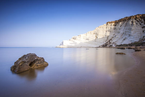 White cliffs known as Scala dei Turchi frame the calm sea at dawn Porto Empedocle province of Agrigento Sicily Italy Europe