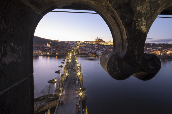 Vltava (Moldava) river framed by Charles Bridge at dusk Prague Czech Republic Europe