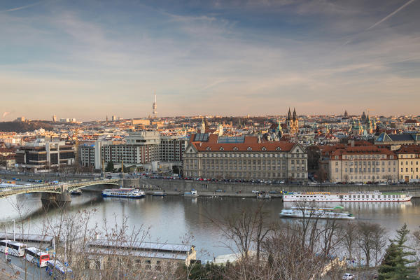 Sunset on the historical bridges and buildings reflected on Vltava (Moldava) river Prague Czech Republic Europe