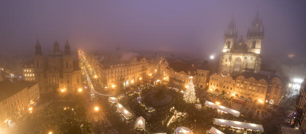 Panorama of Christmas Markets and Cathedral of Saint Vitus surrounded by fog Old Town Square Prague Czech Republic Europe