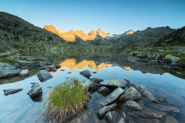The rocky peaks are reflected in Lago Nero at dawn Cornisello Pinzolo Brenta Dolomites Trentino Alto Adige Italy Europe