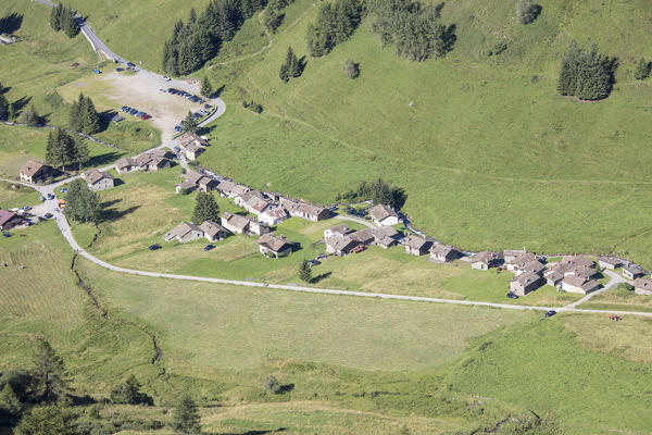 The typical alpine village of Case Di Viso surrounded by green meadows Camonica Valley province of Brescia Lombardy Italy Europe