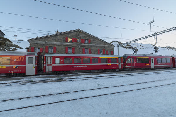 The Bernina Express train at the railway station of Ospizio Bernina canton of Graubünden Engadine Switzerland Europe