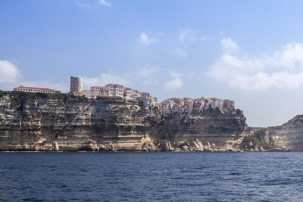 The blue sea frames the ancient village perched on the white cliffs Lavezzi Islands Bonifacio Corsica France Europe
