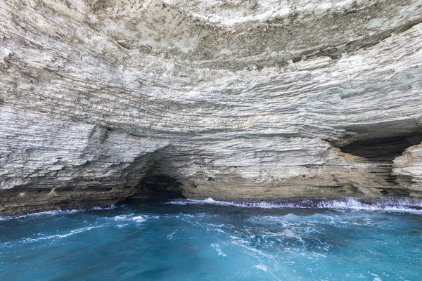 The turquoise sea framed by granite white cliffs and sea caves Lavezzi Islands Bonifacio Corsica France Europe