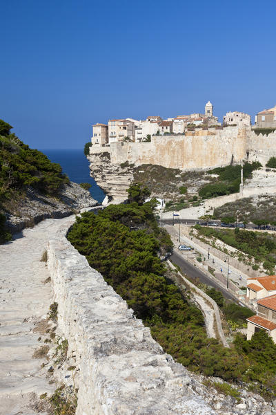 Ancient footpath leads to the medieval old town perched on top of cliffs overlooking the  sea Bonifacio Corsica France Europe