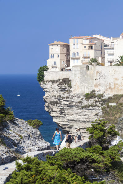 Blue sea frames the medieval old town and fortress perched on top of cliffs Bonifacio Corsica France Europe