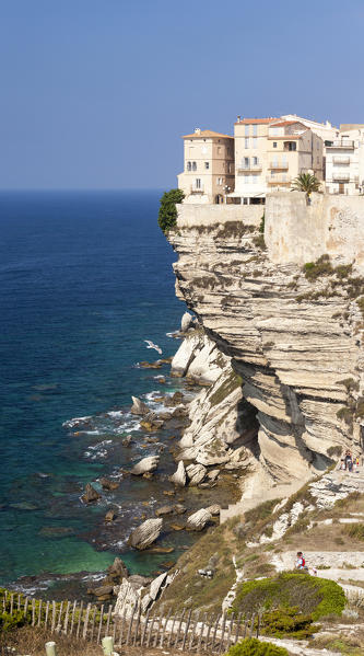 Panorama of the medieval old town and fortress perched on top of cliffs framed by the blue sea Bonifacio Corsica France Europe