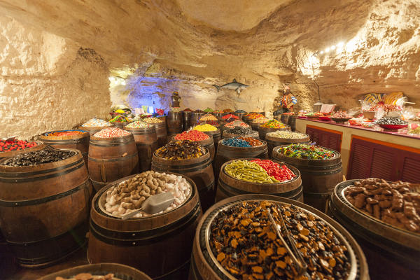 The interior of sweet shop built in a rock cave. Bonifacio, Corsica, France