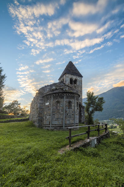 Pink clouds at sunset on the old Abbey of San Pietro in Vallate Piagno Sondrio province Lower Valtellina Lombardy Italy Europe