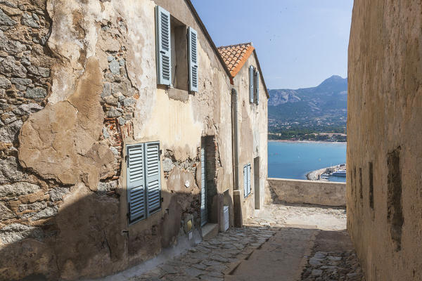 Ancient buildings in the alleys of the old citadel overlooking the sea of Calvi Balagne Region northwest Corsica France Europe