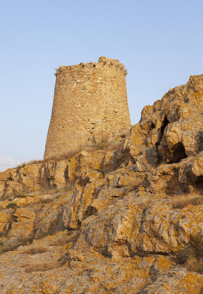 The ancient Genoese tower built as fortress with granite rocks at sunset Ile Rousse Balagne Region Corsica France Europe