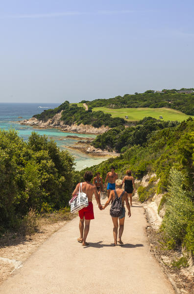 Tourists admire the turquoise sea and the golf course perched on the promontory Sperone Bonifacio South Corsica France Europe