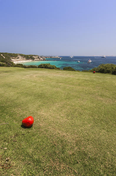 Sun shines on the green meadows of the golf course overlooking the turquoise sea Sperone Bonifacio South Corsica France Europe