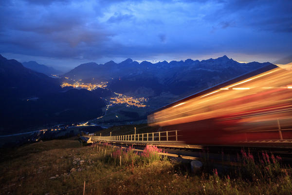 Funicular on the steep mountains lighted by dusk Muottas Muragl St.Moritz Engadine Canton of Graubünden Switzerland Europe