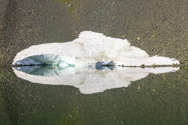 Details of Lake Schottensee partially covered with ice during thaw Flüela Pass canton of Graubünden Engadine Switzerland Europe