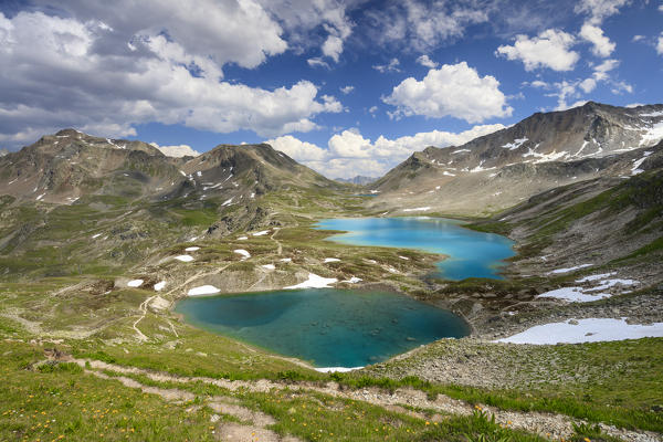 Clouds and sun on turquoise lakes framed by rocky peaks Joriseen Jörifless Pass canton of Graubünden Engadin Switzerland Europe