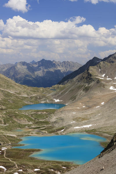 Clouds on the turquoise lakes surrounded by rocky peaks Joriseen Jörifless Pass canton of Graubünden Engadin Switzerland Europe