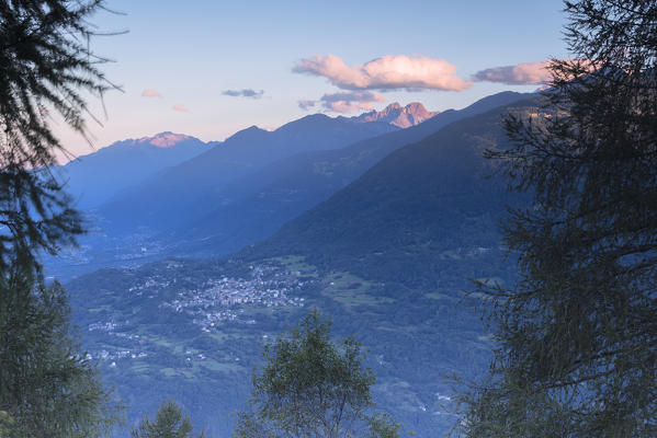 Top view of the village of Teglio framed by the rocky peaks of the Rhaetian Alps at dawn Valtellina Lombardy Italy Europe