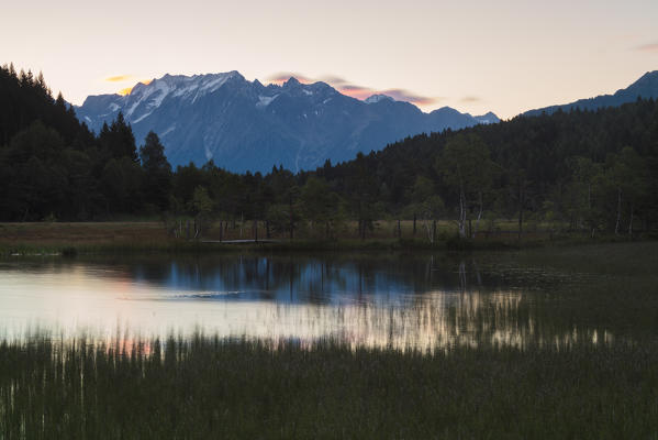 Dawn lights up the swamp of the Natural Reserve of Pian di Gembro Aprica province of Sondrio Valtellina Lombardy Italy Europe