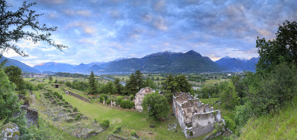 Panorama of ancient ruins of Fort Fuentes framed by green hills at dawn Colico Lecco province Lombardy Valtellina Italy Europe