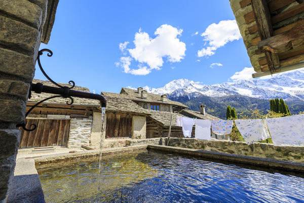 Typical fountain in the alpine village of Soglio Maloja canton of Graubunden Engadin Bregaglia Valley Switzerland Europe