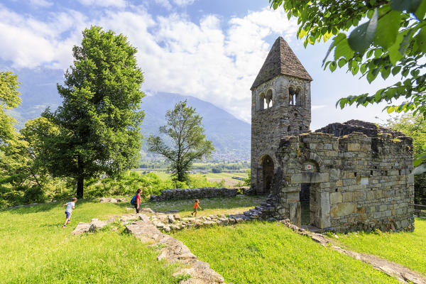 The medieval Abbey of San Pietro in Vallate framed by meadows Piagno Sondrio province Lower Valtellina Lombardy Italy Europe